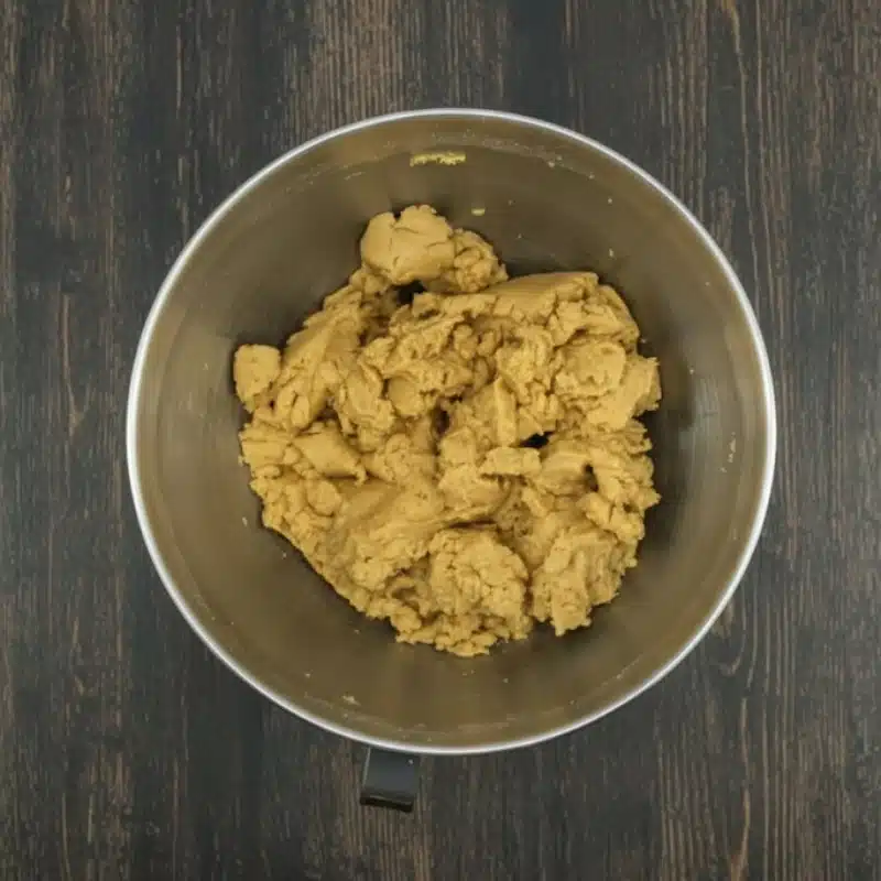 The 3-ingredient peanut butter fudge mixture fully combined into a thick, smooth batter in a mixer bowl.
